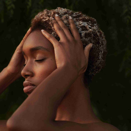 woman showing healthy scalp care on short hair